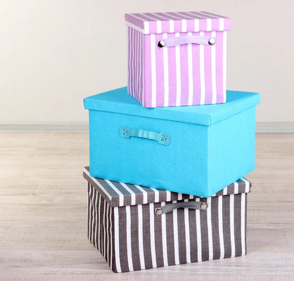 Textile boxes on floor in room — Stock Photo, Image