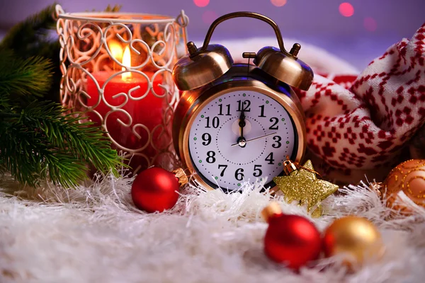 Composition with plaids, candles and Christmas decorations, on white carpet on bright background — Stock Photo, Image