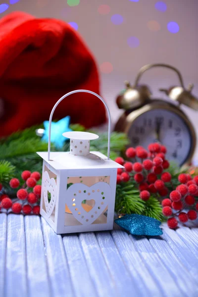 Christmas lantern, fir tree and decorations on light background — Stock Photo, Image