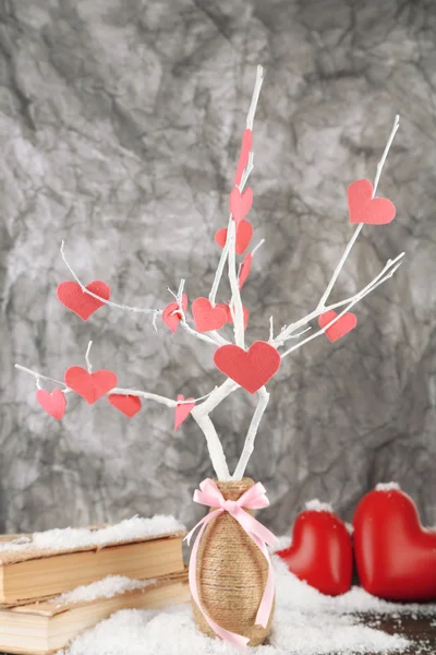 Decorative branch with hearts, on grey background — Stock Photo, Image