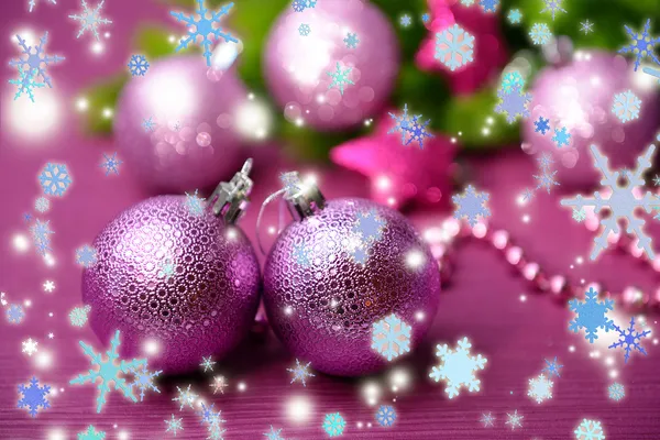Christmas balls on fir tree, on color background Stock Photo