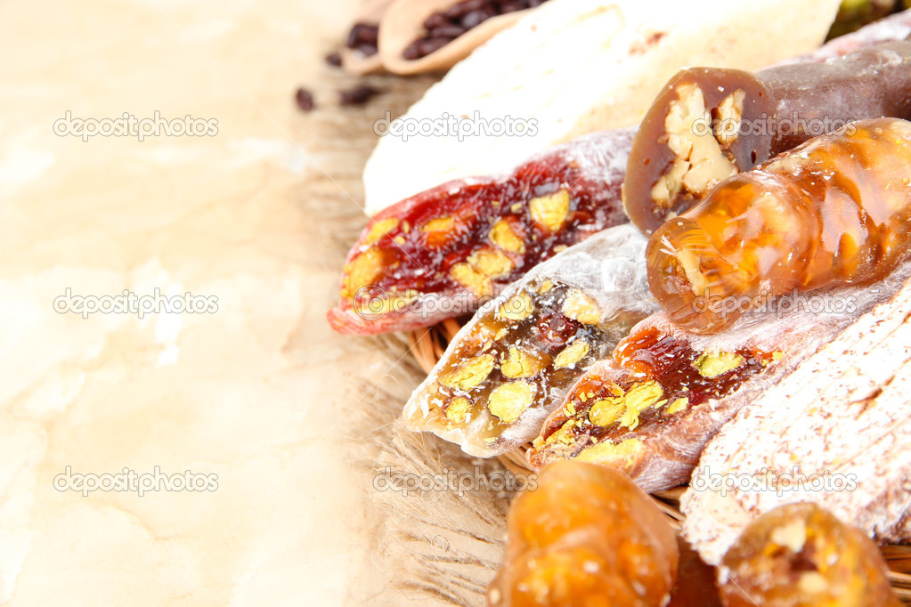 Tasty oriental sweets, on brown background