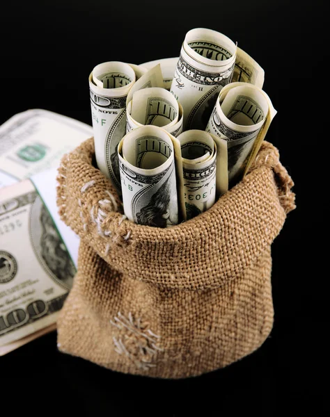 Money in bag on dark background — Stock Photo, Image