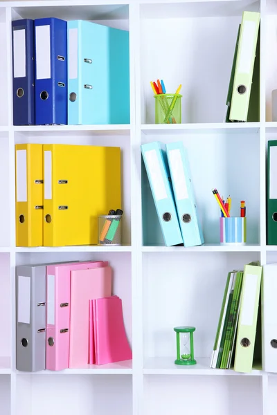 White office shelves with folders and different stationery, close up — Stock Photo, Image