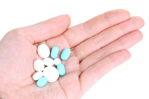 Pastillas en mano aisladas en blanco — Foto de Stock