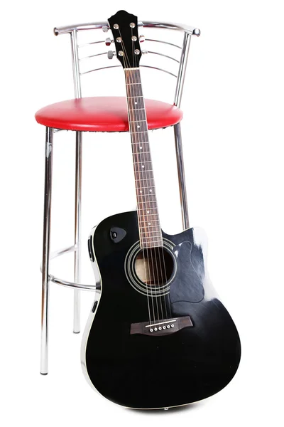 Acoustic guitar near chair, isolated on white — Stock Photo, Image