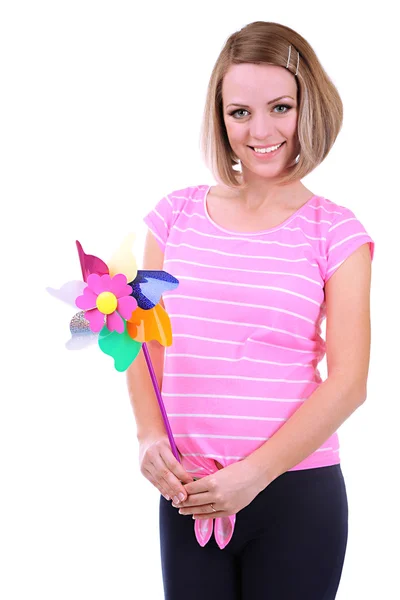 Young pregnant woman holding colorful windmill isolated on white — Stock Photo, Image