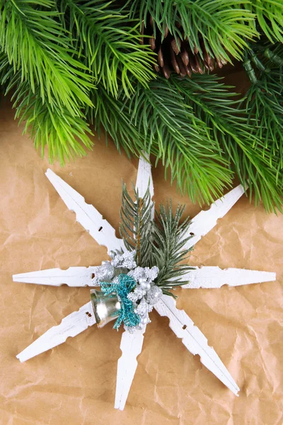Beautiful snowflake with fir branch on paper background — Stock Photo, Image