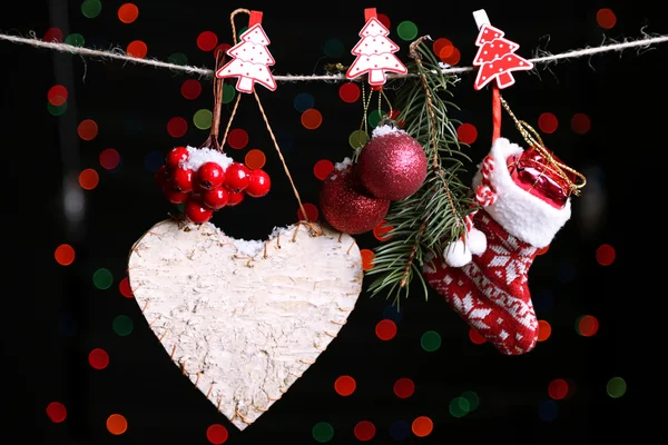 Santa sock and Christmas accessories on black background with lights — Stock Photo, Image