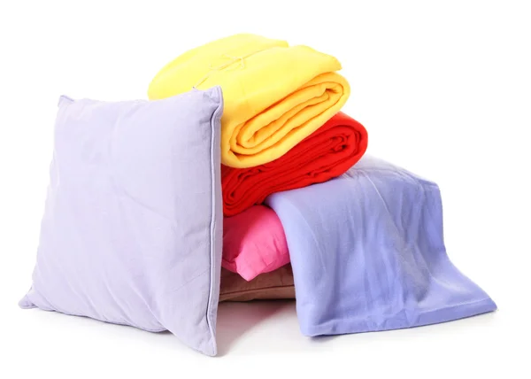 Travesseiros e travesseiros brilhantes, isolados sobre branco — Fotografia de Stock