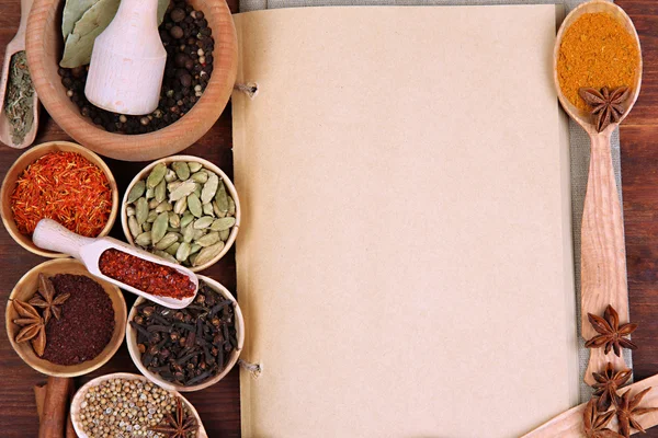 Various spices and herbs with empty white blank for recipe — Stock Photo, Image