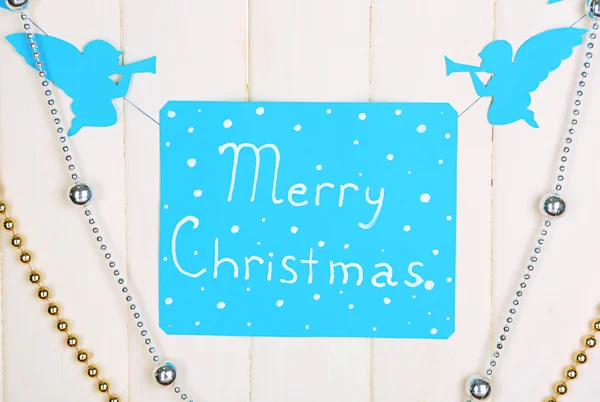 Signboard with words Merry Christmas on wooden table background close-up — Stock Photo, Image