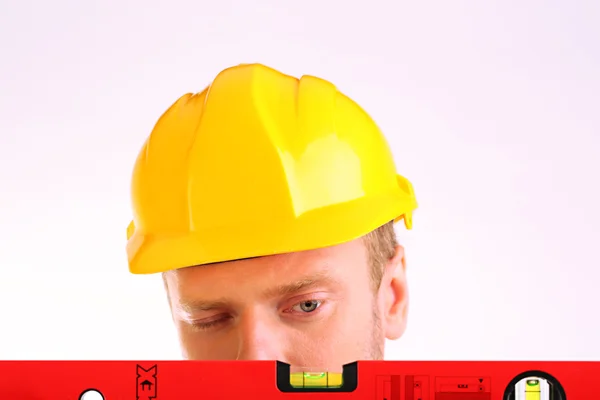 Retrato de joven constructor aislado en blanco —  Fotos de Stock