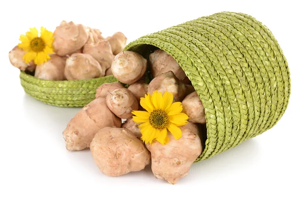 Topinambur roots in wicker basket isolated on white — Stock Photo, Image