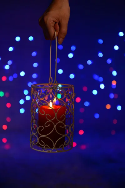 Candle on blur lights background — Stock Photo, Image