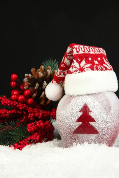 Holiday apple with frosted Christmas tree in snow on black background — Stock Photo, Image