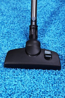 Vacuuming carpet in house clipart