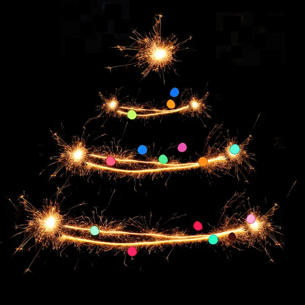 Sparklers in Christmas tree-shaped — Stock Photo, Image