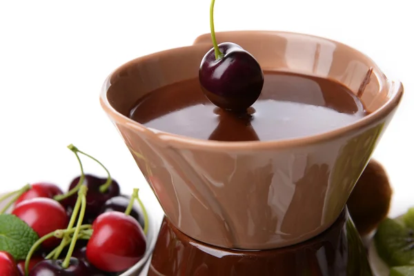 Chocolate fondue with sliced fruits, isolated on white — Stock Photo, Image