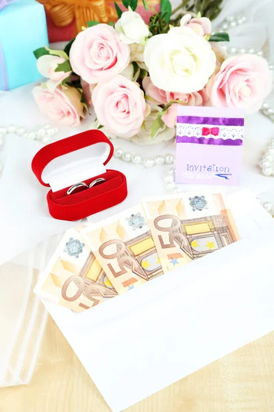 Euro banknotes as gift at wedding on wooden table close-up — Stock Photo, Image