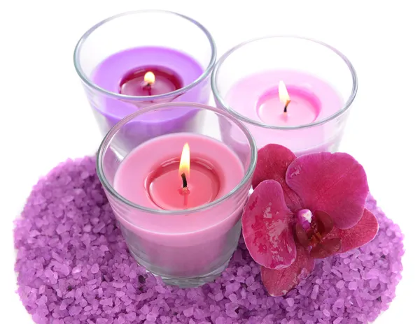 Beautiful colorful candles, orchid flower, sea salt isolated on white — Stock Photo, Image