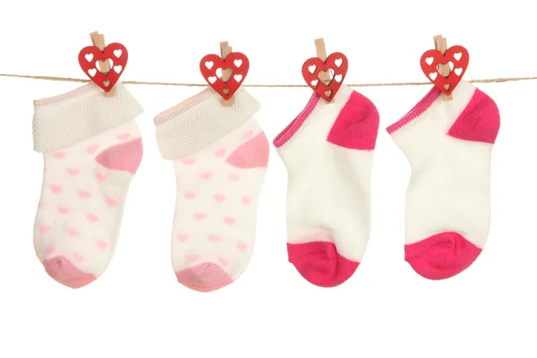 Socks hanging on clothesline isolated on white — Stock Photo, Image