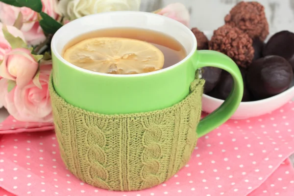 Cup with knitted thing on it close up — Stock Photo, Image