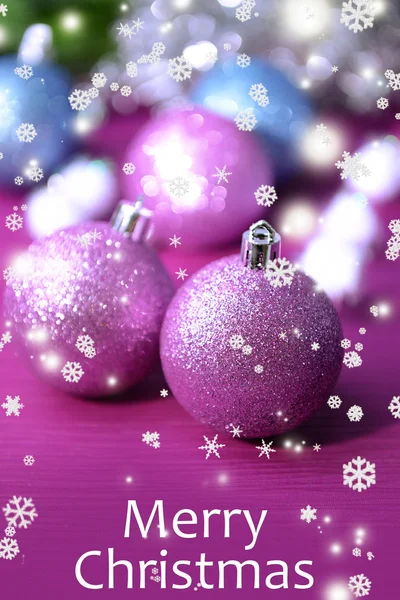 Christmas balls on fir tree, on color background — Stock Photo, Image