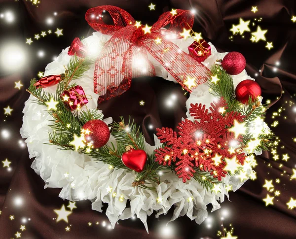 Christmas wreath on fabric background — Stock Photo, Image