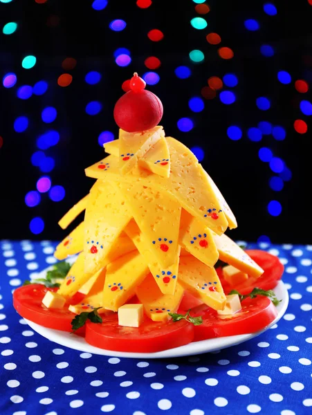 Christmas tree from cheese on table on dark background — Stock Photo, Image