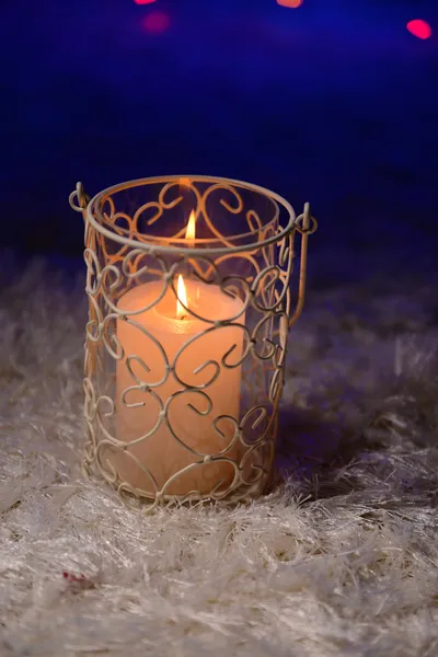 Candle on blur lights background — Stock Photo, Image