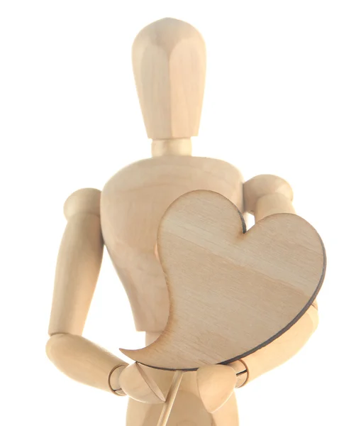Dřevěný manekýn drží srdce izolovaných na bílém — Stock fotografie