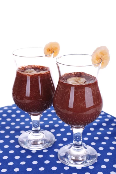 Cocktails with banana and chocolate on table on white background — Stock Photo, Image