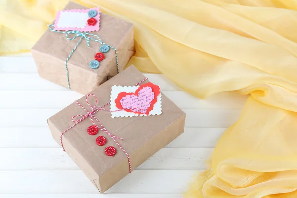 Paper gift boxes on wooden background — Stock Photo, Image