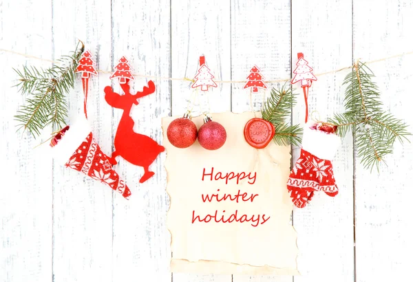 Christmas accessories hanging on white wooden wall — Stock Photo, Image