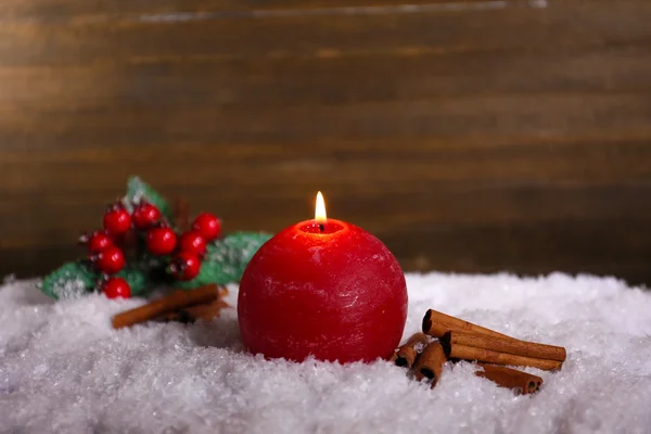 Burning candle on wooden background — Stock Photo, Image