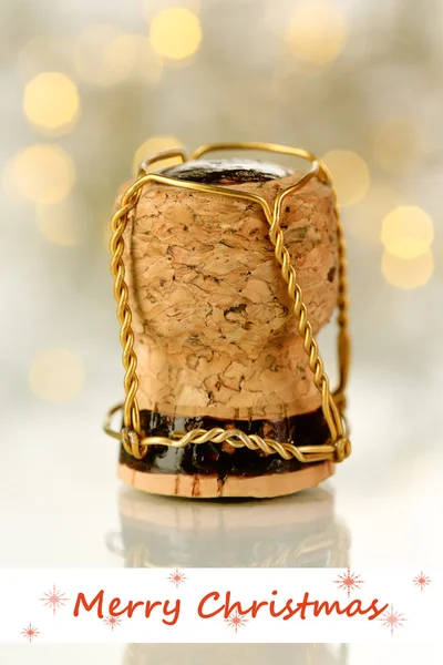 Corcho de champán sobre fondo de luces de Navidad — Foto de Stock