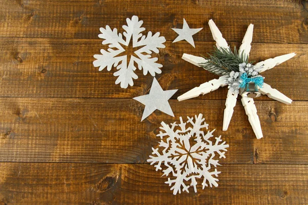 Beautiful snowflakes on wooden background — Stock Photo, Image