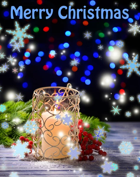 Candle and Christmas tree bud on wooden table on bright background — Stock Photo, Image