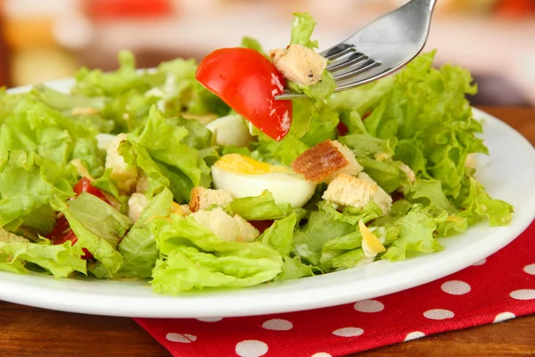 Caesar salad on white plate, on bright background — Stock Photo, Image