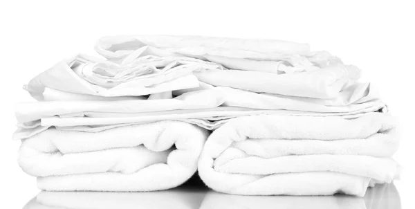 Stack of rumpled bedding sheets isolated on white — Stock Photo, Image