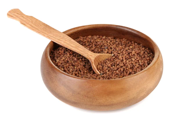 Buckwheat groats in bowl and wooden spoon isolated on white — Stock Photo, Image