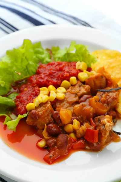 Chili Corn Carne - traditional mexican food, on white plate, on napkin, close up — Stock Photo, Image