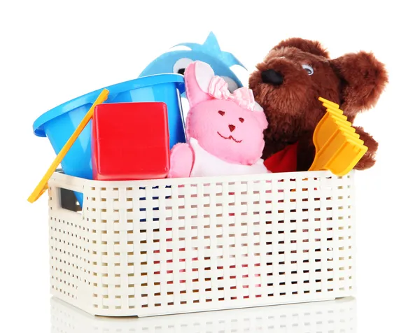 Plastic basket with toys isolated on white — Stock Photo, Image