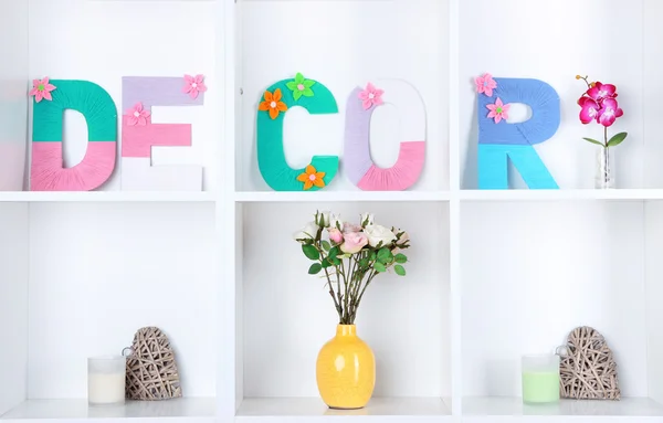 White shelves decorated with handmade knit word — Stock Photo, Image