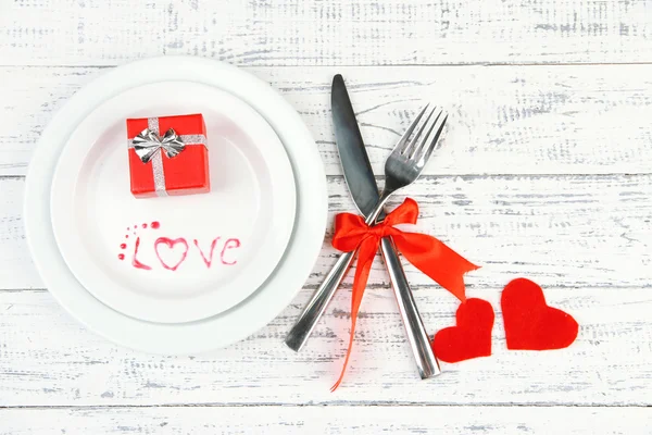 Romantic holiday table setting, on wooden background — Stock Photo, Image