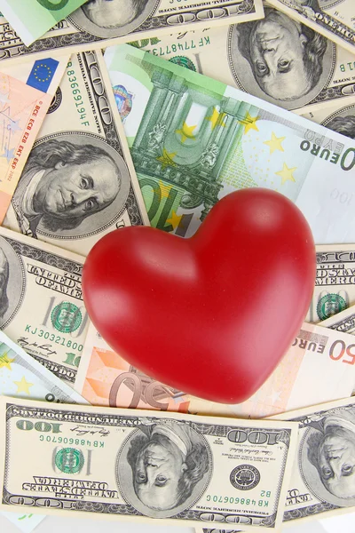 Love and money concept. Heart on European and American money — Stock Photo, Image