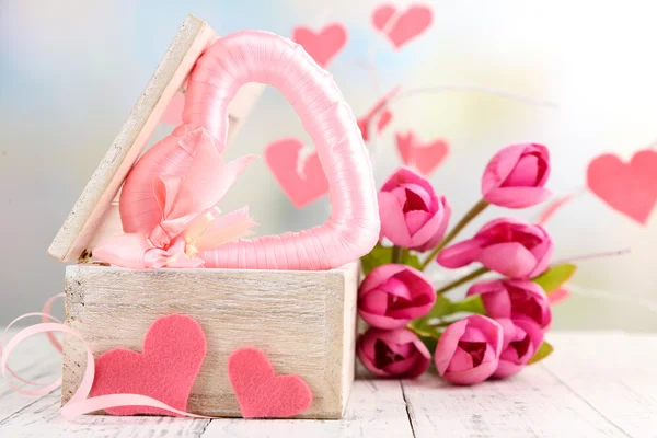 Romantic still life with heart in wooden casket — Stock Photo, Image