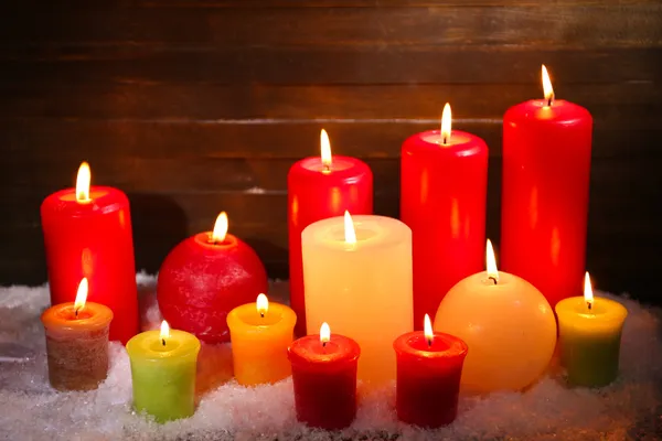 Burning candles on wooden background — Stock Photo, Image