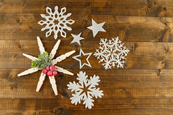 Beautiful snowflakes on wooden background — Stock Photo, Image